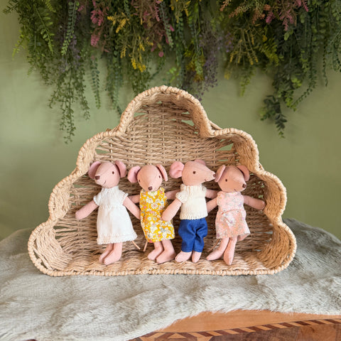 Handmade Mum and Dad mouse dolls with two mouse children sitting in a woven cloud-shaped shelf
