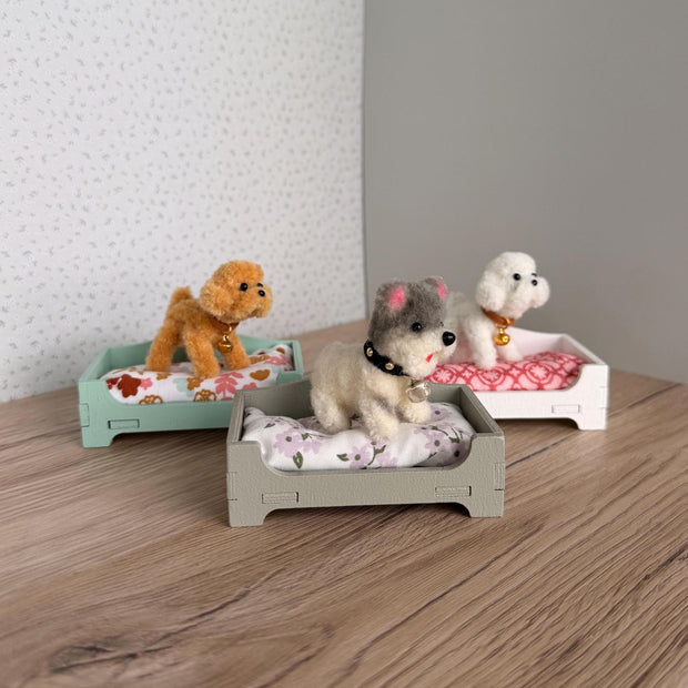 Miniature dollhouse dog bed with plush puppy