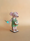 Pip, a handmade fabric mouse doll in green check overalls with a tiny camera and walkie-talkie